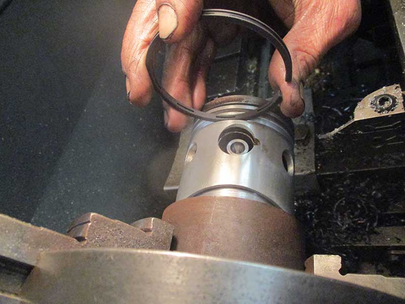 Piston being machined